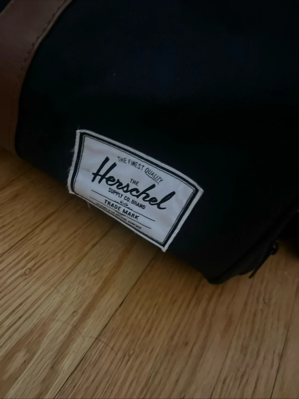 Herschel Supply Company Black Duffel with Brown Handles